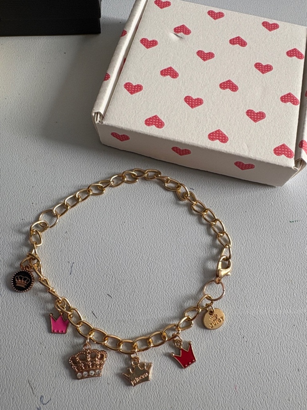 Juicy Couture Gold-Tone Charm Bracelet with Pink Crown Charms